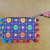 Bolsinha indiana clutch bordada com espelhinhos e pompons marinho e color