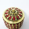 Mini porta jóias indiano de metal dourado com pedras vermelhas