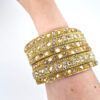 Conjunto de 6 pulseiras indianas de metal com pedrarias dourada