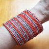 conjunto de 24 pulseiras indianas laranja e prateado