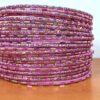 Conjunto de 24 pulseiras indianas de metal com brilhos rosa