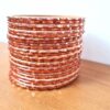 Conjunto de 24 pulseiras indianas de metal com brilhos laranja em 2 tons