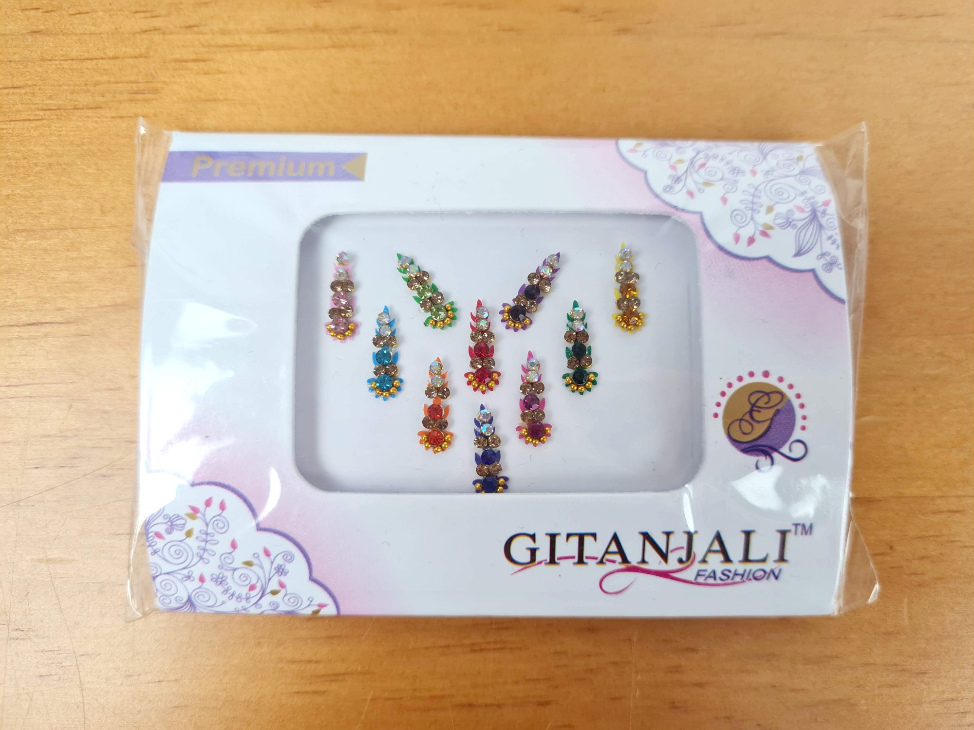 bindi indiano adesivo colorido com brilhos para usar no terceiro olho