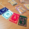Kit 5 mini Bandeiras tibetanas veludo do mantra "Om Mani Padme Hum" (5cm x 4cm)