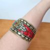 Bracelete indiano dourado com pedrarias coral e turquesa