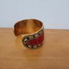 Bracelete indiano dourado com pedrarias coral e turquesa