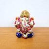 Ganesha mini produzido com a técnica tradicional indiana, o cloisonné, que é baseada em esmaltação especial em metal. Branco e colorido. 6cm
