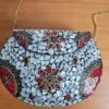 Bolsa indiana rígida de metal com mosaico de pedras naturais madrepérolas e coral