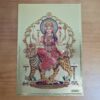 Folha laminada dourada em 30x21cm com a imagem da Deusa Durga. Lindo para colocar na parede com moldura.