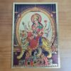 Folha laminada dourada em 30x21cm com a imagem da Deusa Durga. Lindo para colocar na parede com moldura.