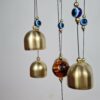 Sino dos ventos de metal com imagem de Ganesha e pedras de Olho Grego 55cm