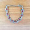 pulseira Hamsa prateada e vermelha