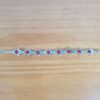 Pulseira de prata alemã de Hamsa com berloques vermelhas