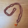 Japamala indiano de 108 contas de Rudraksha 7mm tassel laranja