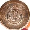Tigela tibetana com 7 ligas dourada símbolo OM 12cm