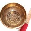 Tigela tibetana com 7 ligas dourada símbolo OM 12cm