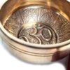 Tigela tibetana com 7 ligas dourada símbolo OM 12cm