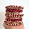 Conjunto de pulseiras indianas 24 peças douradas e vermelhas Ishani